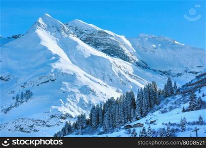 Winter mountain top view with snowy slope (Austria, Tyrol).