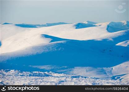 Winter mountains and white snow hills