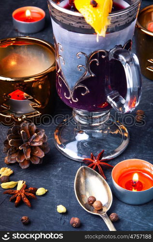 Winter mulled wine. Christmas mulled wine with an orange slice in a stylish glass