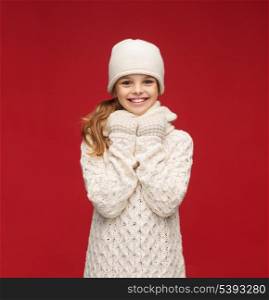 winter, people, happiness concept - girl in hat, muffler and gloves