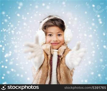 winter, people, happiness concept - happy little girl in winter clothes