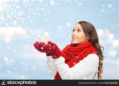 winter, people, happiness concept - happy woman in scarf and mittens with christmas ball