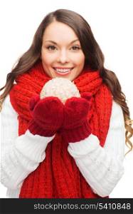 winter, people, happiness concept - happy woman in scarf and mittens with christmas ball