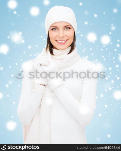 winter, people, happiness concept - woman in hat, muffler and gloves