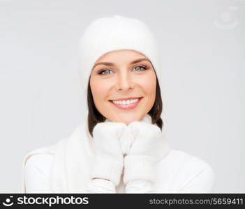 winter, people, happiness concept - woman in hat, muffler and gloves
