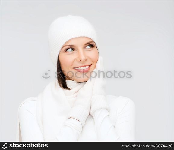 winter, people, happiness concept - woman in hat, muffler and gloves