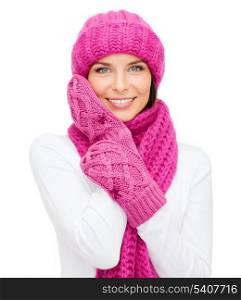 winter, people, happiness concept - woman in hat, muffler and mittens