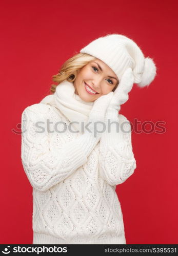 winter, people, happiness concept - woman in hat, scarf and mittens