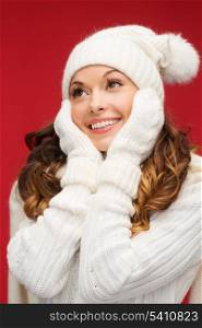 winter, people, happiness concept - woman in hat, scarf and mittens