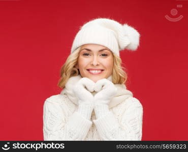 winter, people, happiness concept - woman in hat, scarf and mittens