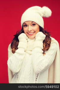 winter, people, happiness concept - woman in hat, scarf and mittens