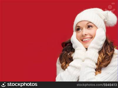 winter, people, happiness concept - woman in hat, scarf and mittens