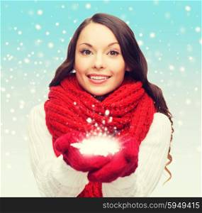 winter, people, happiness concept - woman in scarf and gloves with big snowflake