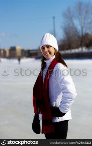 Winter portrait of an attractive woman with a red scarf