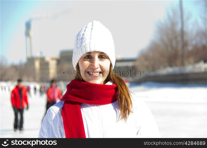 Winter portrait of an attractive woman with a scarf