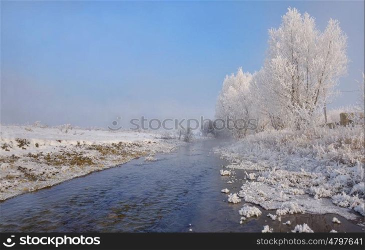 Winter river on a sunny day in Brasov, Romania