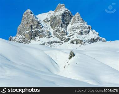 Winter rock top view with snowy slope (Austria, Tyrol).