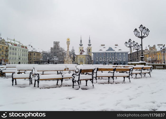 Winter scene from the Union Square, benches covered in snow.