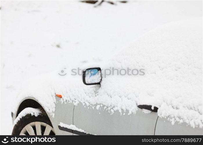 Winter season and seasonal specific. car covered in snow closeup