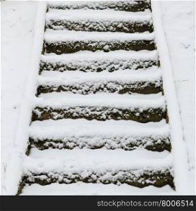 Winter season and seasonal specific. staircase outdoor covered with snow