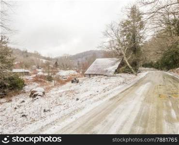 winter shack and mountain farm road