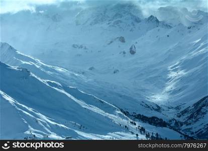 Winter Silvretta Alps cloudy snowfall landscape, Tyrol, Austria.
