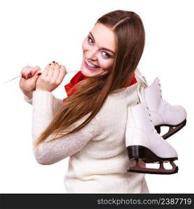 Winter skate sport people concept. Attractive girl with ice skates. Young woman has white outfit and long beutiful hair.. Attractive girl with ice skates.