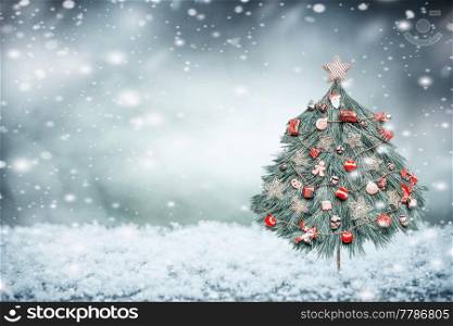 Winter snow background with decorated Christmas tree