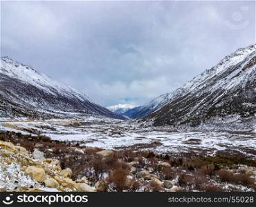 Winter snow covered the valley and the high mountain in Sichuan, China
