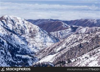 Winter Snowy Mountains valley with sun in Ak Bulak, Almaty, Kazakhstan, Asia
