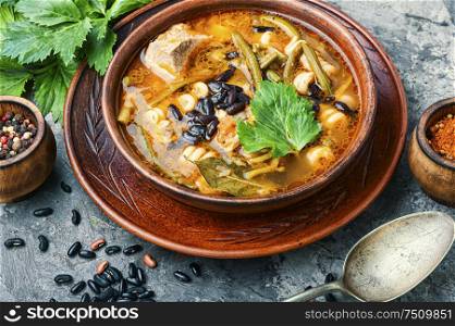 Winter soup with meat and black beans. Meat soup with beans