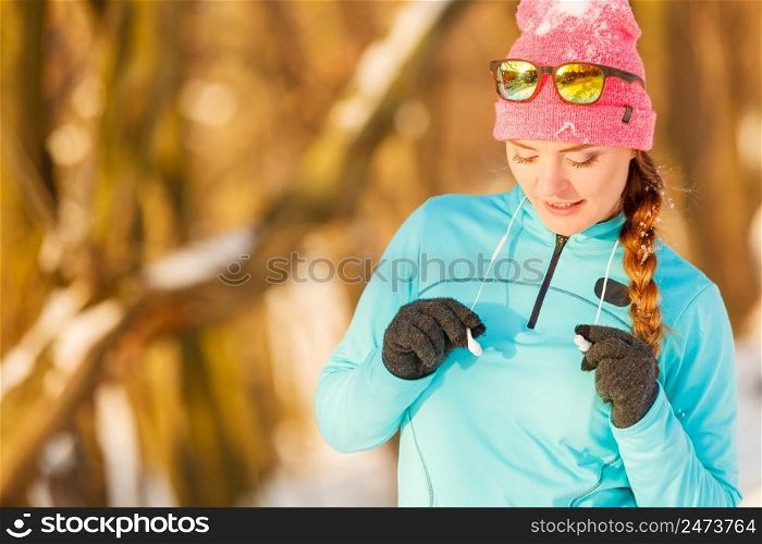 Winter sport and female fashion. Choosing good sportswear for chilling temperatures. Health fitness safety concept.. Winter sport and female fashion