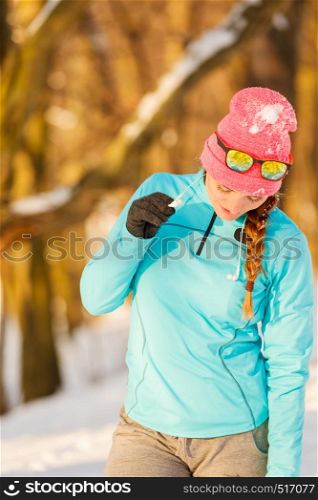 Winter sport and female fashion. Choosing good sportswear for chilling temperatures. Health fitness safety concept.. Winter sport and female fashion