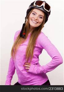 Winter sport hobby people concept. Woman with sporty helmet. Young lady wearing pink clothing.. Woman with sporty helmet.