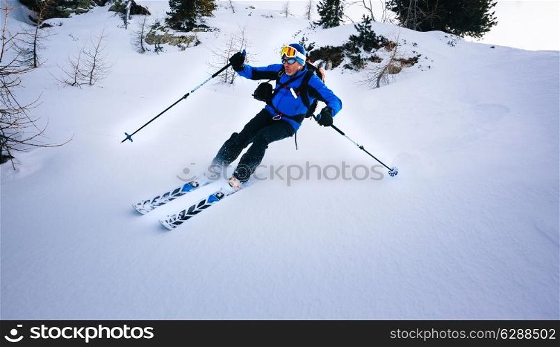 Winter sport: man skiing in powder snow. Val D&rsquo;Aosta, italian Alps, Europe.