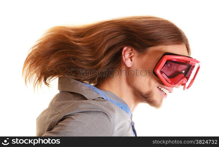 Winter sports and happiness concept. funny man long hair in ski glasses snowboard goggles studio shot isolated on white