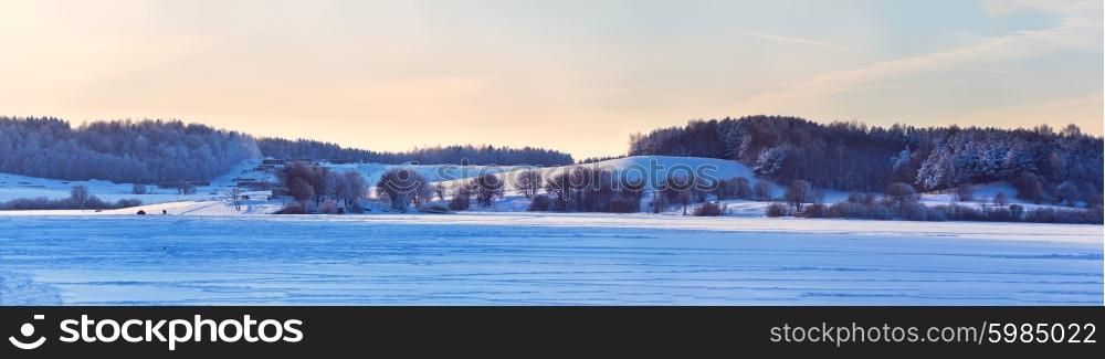 Winter sunny day in Belarus. Cold winter day. Winter lake.