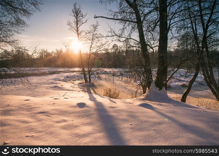 Winter sunrise in Belarus. Cold winter morning. Winter river.