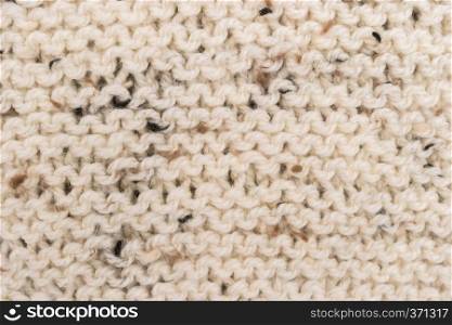 Winter Sweater Design. Bege knitting wool texture background. knitted fabric texture. Knitted jersey background with a relief pattern. Braids in knitting