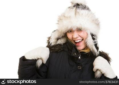 Winter vacation. Cheerful positive girl in warm clothes. Happy young woman in fur hat doing fun isolated on white.