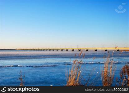 Winter view at the Oland bridge from the island Oland in the Baltic Sea