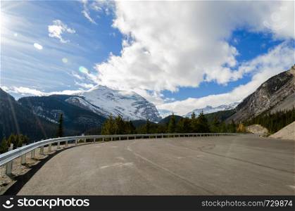 Winter view of Canadian Rockies mountains and winding Columbia icefield highway in Jasper National Park, Alberta, Canada