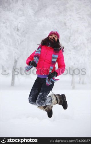 winter women jump in snow