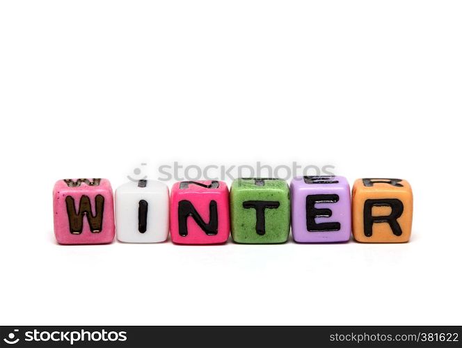 winter - word made from multicolored child toy cubes with letters