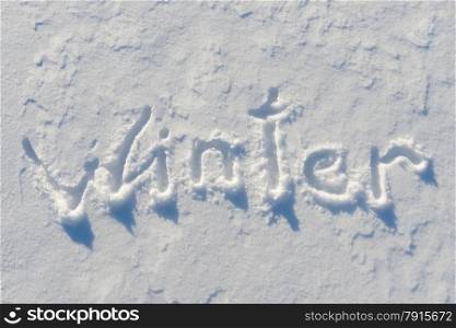 Winter word written on the snow surface