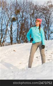 Winter workout in the morning. Girl exercising in the snow. Health nature fitness concept. . Winter workout in the morning.