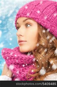winter, x-mas, people, happiness concept - woman in hat and scarf