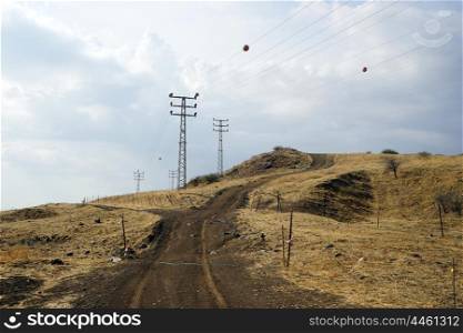 Wire and pylons on the farmland in Israel