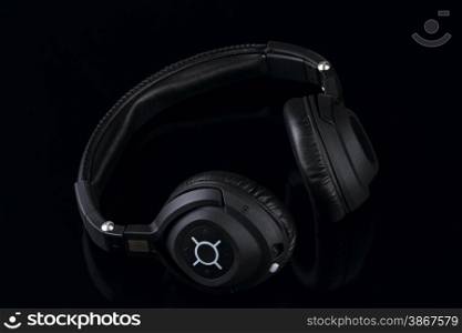 wireless bluetooth travel headphones isolated on black background