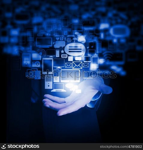 Wireless connection. Close up of businessman hand showing digital icons